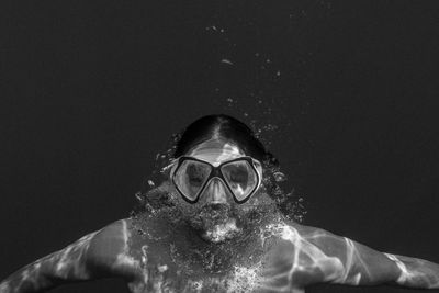 Portrait of shirtless woman snorkeling in sea
