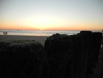 Scenic view of sea against clear sky during sunset