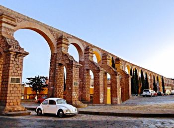 Car on street against clear sky