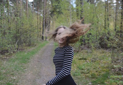 Portrait of young man in forest