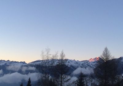 Snowcapped mountains against clear sky