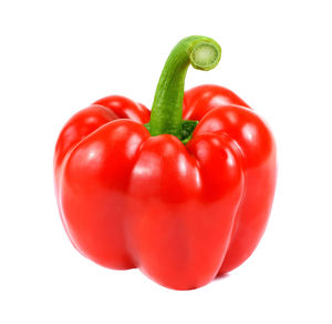 Close-up of red bell peppers against white background