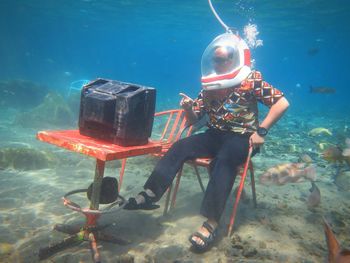 Man watching tv in sea