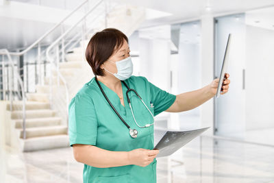 Midsection of person holding smart phone