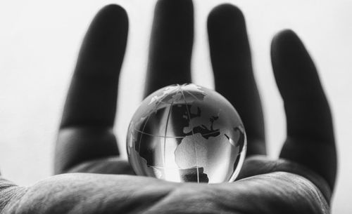 Close-up of person holding glass