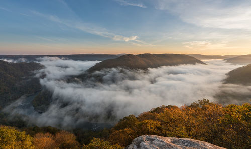 Scenic view of mountains against sky during sunset