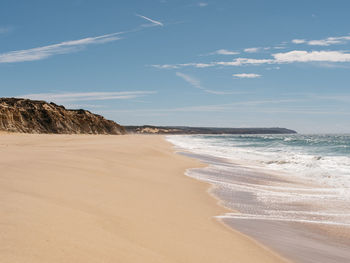 Scenic view of beach against sky