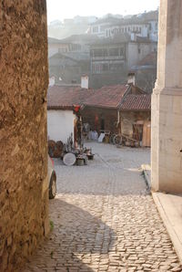 Street amidst buildings against sky