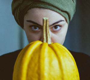 Portrait of woman with pumpkin