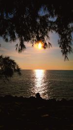 Scenic view of sea against sky at sunset