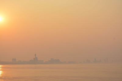 View of buildings against sky during sunset
