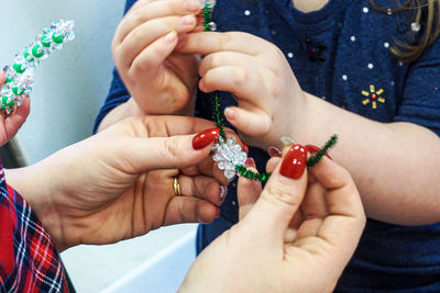 Close-up of women holding decoration