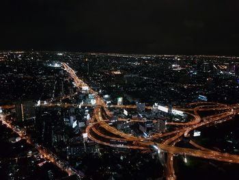 Aerial view of illuminated city at night