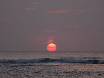 Scenic view of sea at sunset