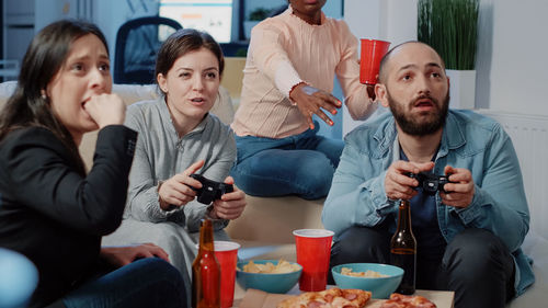 Coworkers playing game after work in office