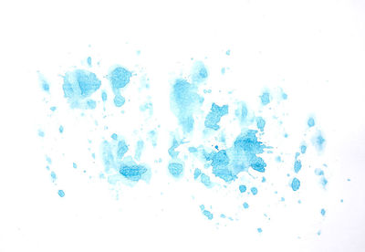 Close-up of bubbles over white background