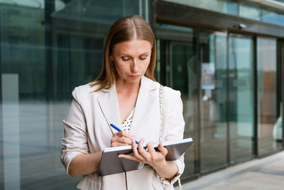 Mid adult woman using mobile phone