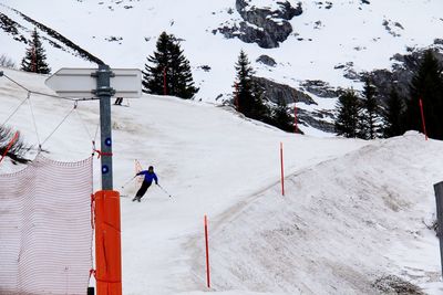 Man skiing on snowcapped mountain