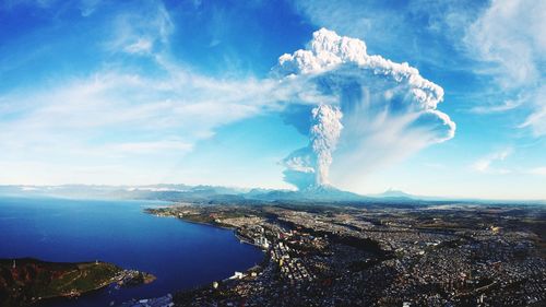Scenic view of smoke emitting from volcano against sky