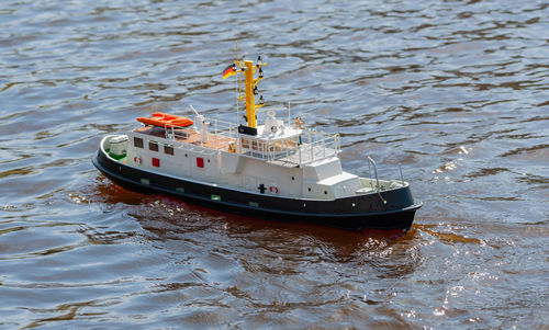 Remote controlled ship model is remote controlled on a lake