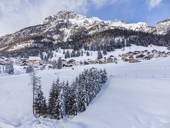 Scenic view of snow covered mountains against sky