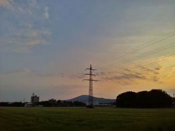 Electricity pylon on field