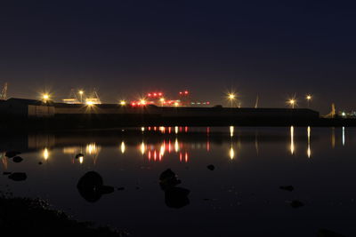 Reflection of illuminated buildings in water