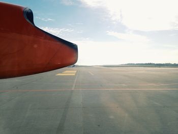 Low angle view of cropped car against sky