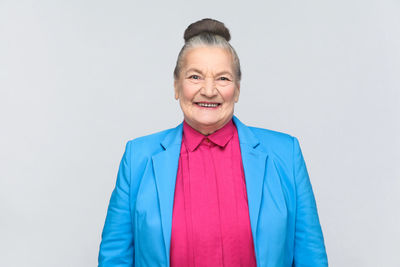 Portrait of smiling mid adult man against white background