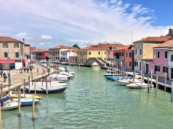 Boats moored at harbor