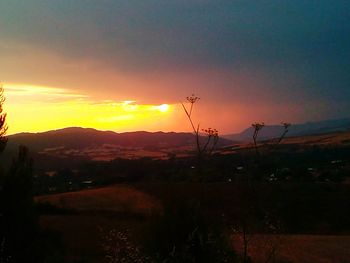 Scenic view of landscape against sky during sunset