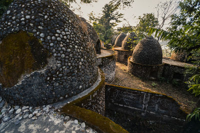 Statue of buddha against trees
