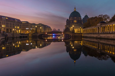 Reflection of illuminated buildings in river