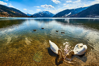 Scenic view of lake and mountains against sky