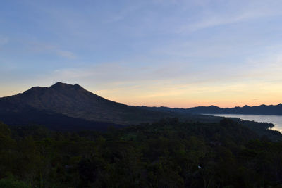 Scenic view of mountains against sky during sunset