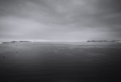 Scenic view of sea against cloudy sky