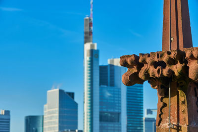 Low angle view of buildings against clear blue sky