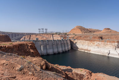 Glen canyon dam during drought against clear blue sky. 