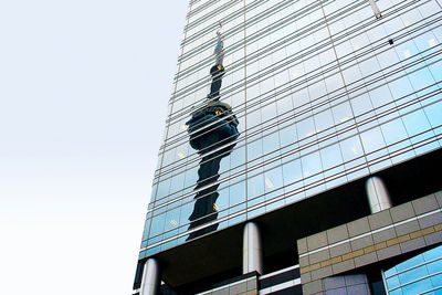 Low angle view of modern building against clear sky