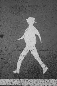 Shadow of man on road