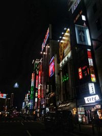 Low angle view of illuminated building at night