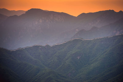 Scenic view of mountains against sky during sunset