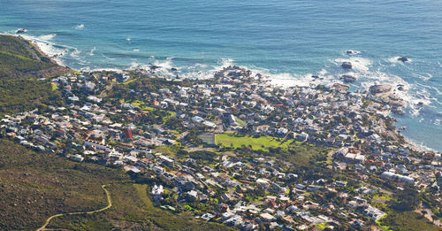 High angle view of buildings by sea