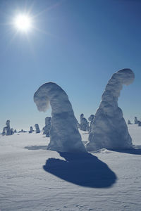 Scenic view of land against clear blue sky on sunny day