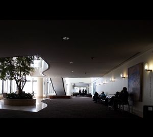 Woman in illuminated corridor