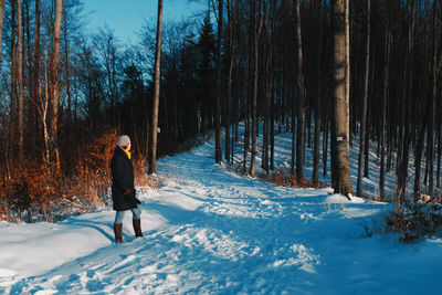 Beautiful woman walking in the snow alone social distancing 