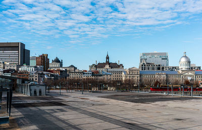 Buildings in city against sky