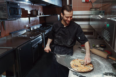 Male chef preparing food in kitchen