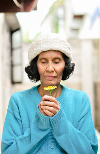 Portrait of woman holding ice cream