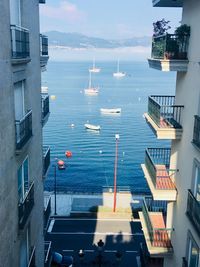 High angle view of buildings by sea